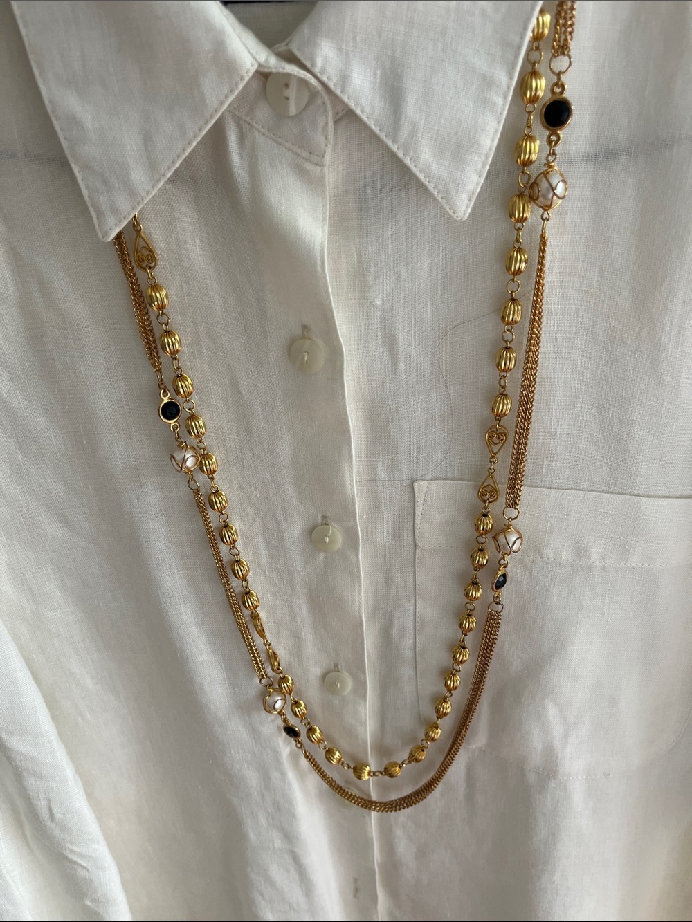 Two gold tone necklaces